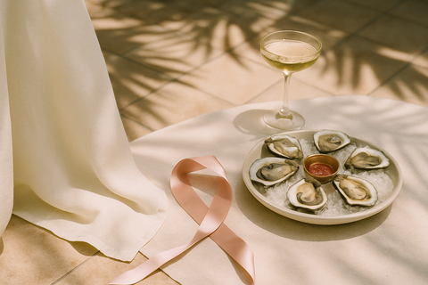 A Key West brunch table with oysters and champagne