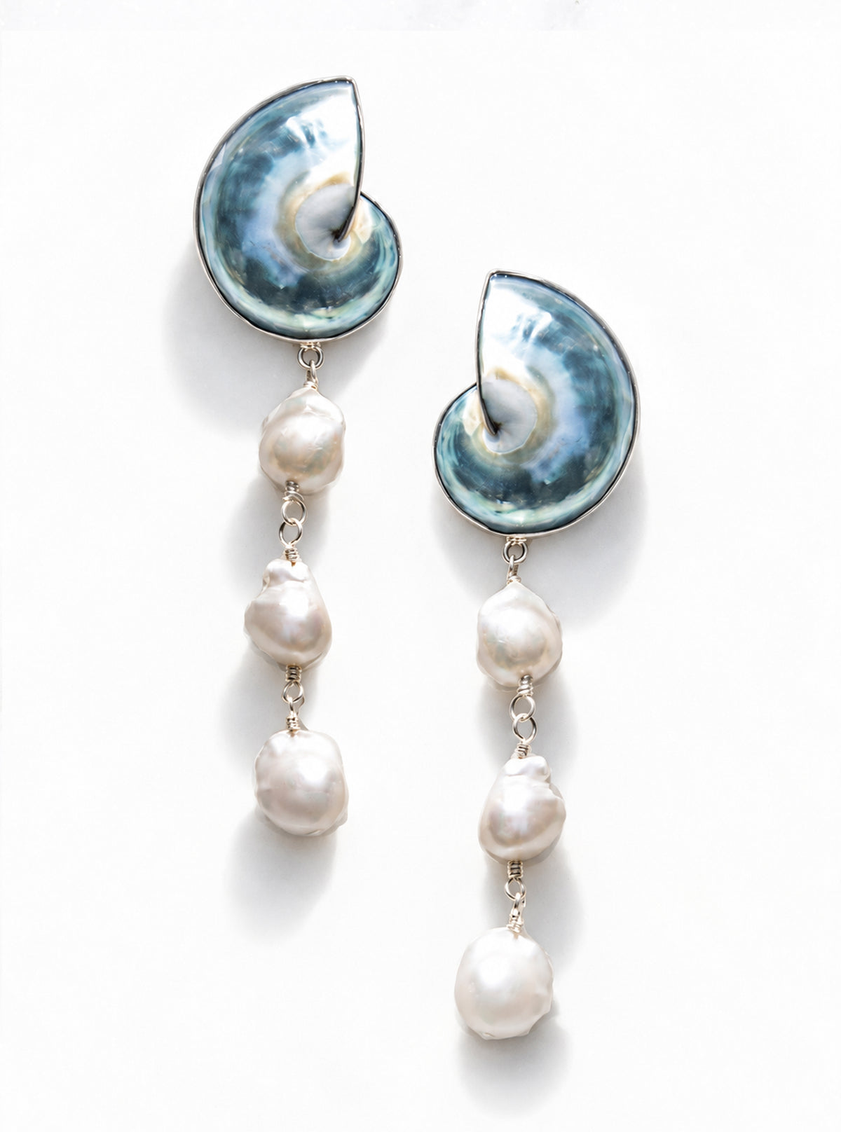A pair of 925 silver encased blue nautilus shell cascade earrings set against a plain white background | Lily Frank Jewelry