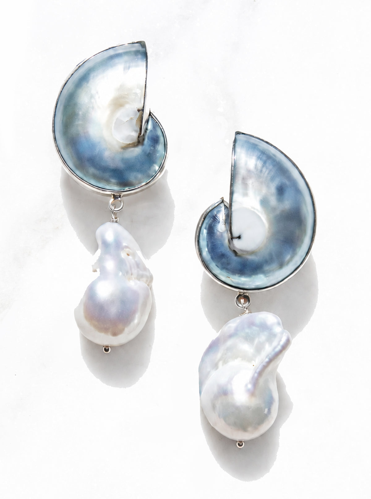 925 Silver Encased Blue Nautilus Shell Drop Earrings featuring blue spiral shells framed in silver and single baroque pearl drops | Lily Frank Jewelry