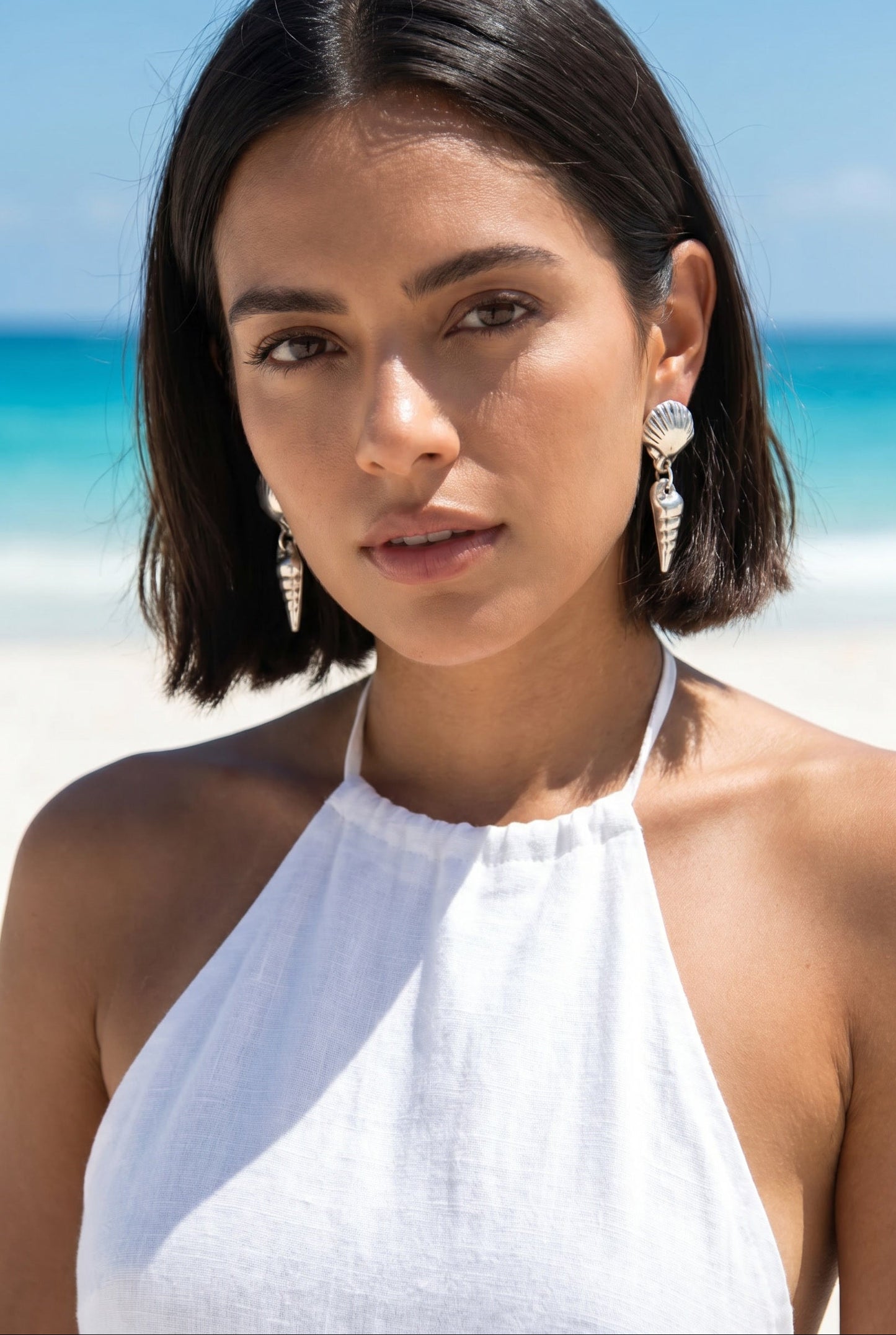 Vintage 925 silver double shell drop earrings on model with beach ocean lifestyle setting — Lily Frank Jewelry