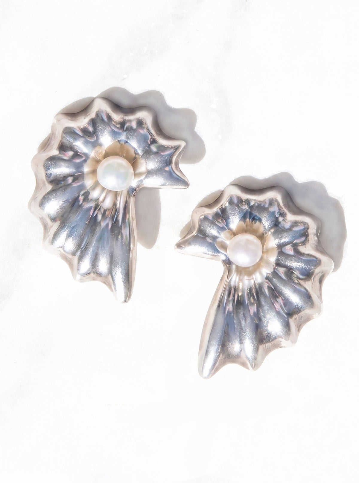 the concha pearl shell earrings on a white marble background in 925 silver | Lily Frank Jewelry