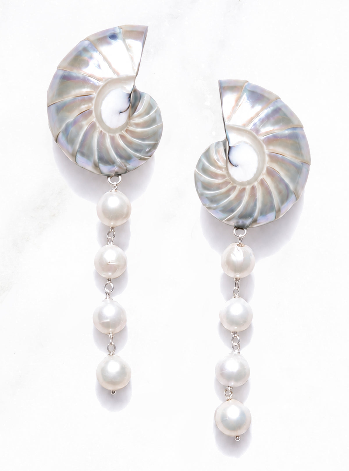 Front view of Large Pearl Nautilus Shell Cascade Earrings with shell tips pointing up, four pearls per earring and silver-colored links on white | Lily Frank Jewelry