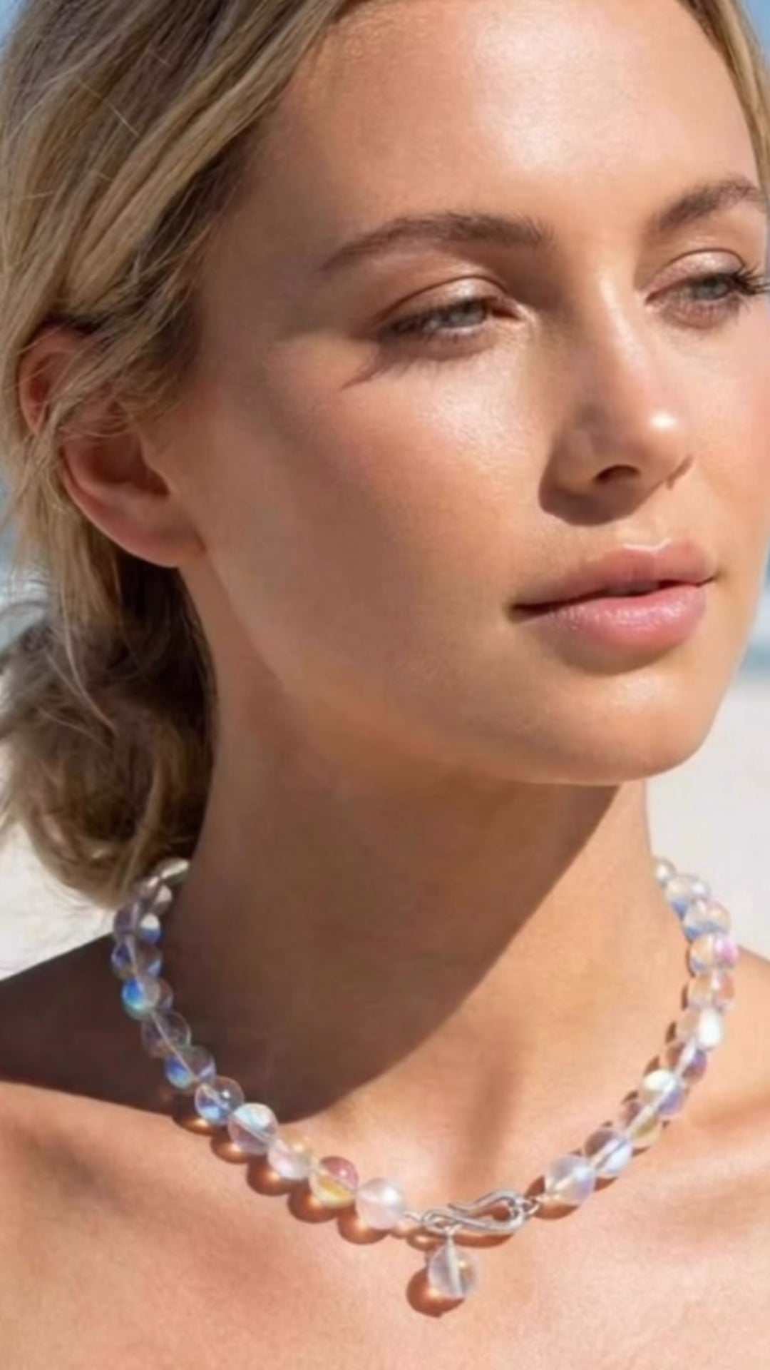 A model in the Lindsay Necklace in Aura Quartz Crystal | Lily Frank Jewelry