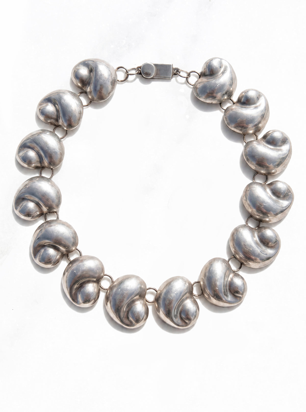 Vintage 925 Silver Nautilus Shell Necklace featuring graduated, polished silver spiral-shell links | Lily Frank Jewelry
