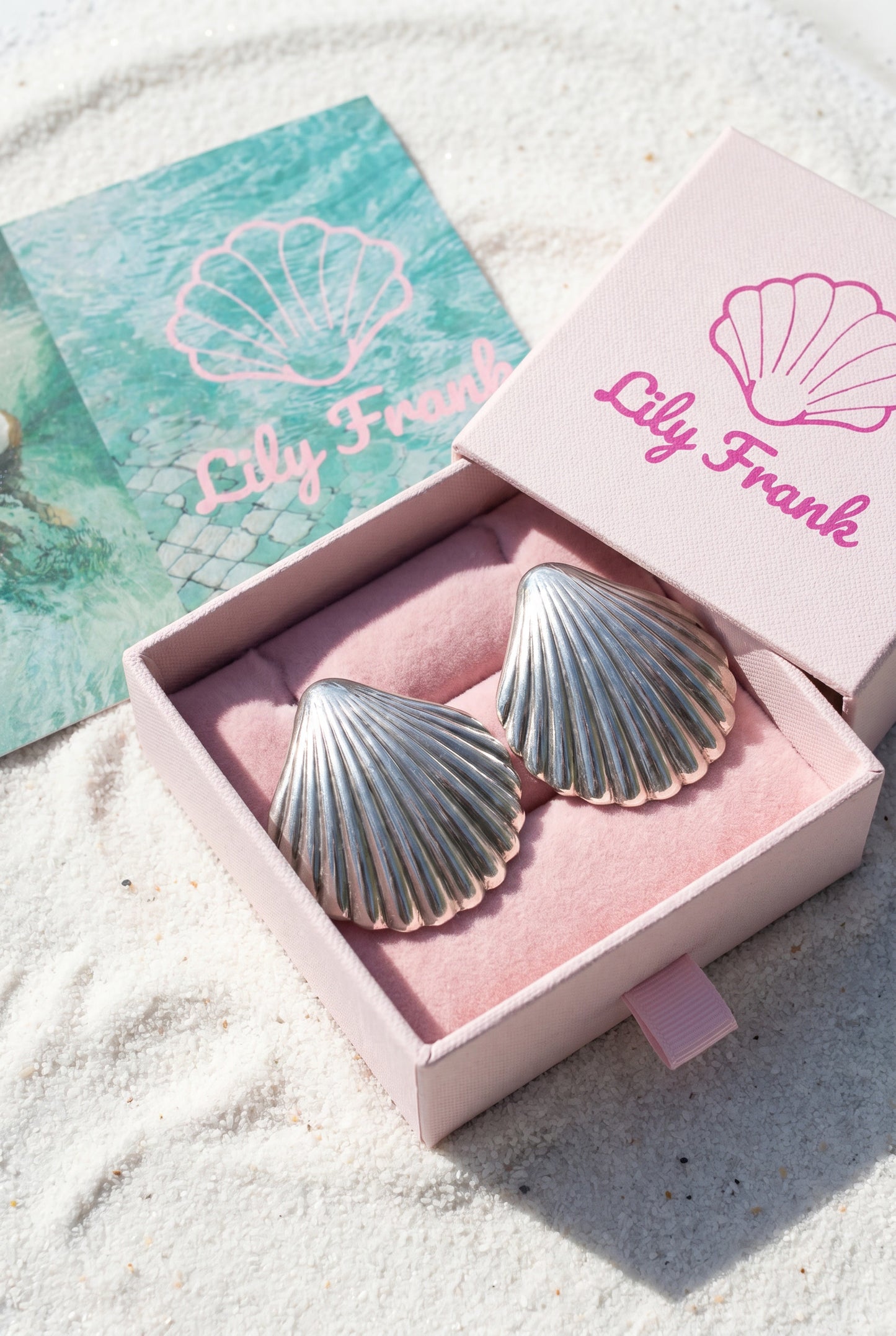 a pair vintage oversized 925 silver shell earrings in a 'Lily Frank' box on a sandy background | Lily Frank Jewelry 